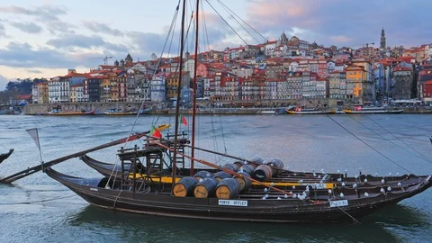 Old town cityscape on the Douro River with traditional Rabelo boats. Porto Video stock 117282143