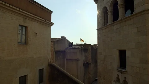 Old Town environment and Catalan Flag. Beautiful Flare. Catalonia. Spain Stock Footage 98476692