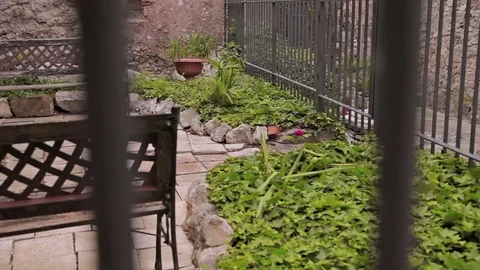 Old Town Minturno A small courtyard with a scofey and a lemon tree Stock Footage 75040295