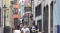 Old Town Narrow Shopping Street Cologne Sight Houses People Crowd Walk Visit Day HD Footage