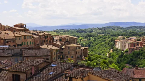Old Town Rooftops Overlooking Lush Green Valley in Tuscany Видео 255472614