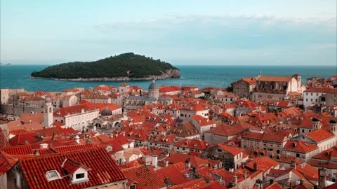 Old Town Skyline with Red Tiled Rooftops and Blue Coastal Sea Horizon View Stockbeeldmateriaal 331103596