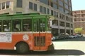 Old Town Trolley tour bus driving past Footage