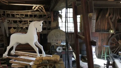 Old toy makers workshop with beautifully crafted wooden toys Stock Footage 76295198
