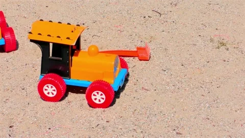 Old Toy Plastic Tractor in The Sand. Stock Footage 159752002