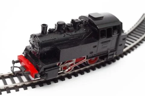 Old toy steam engine on a white background, soft focus Stock Photos