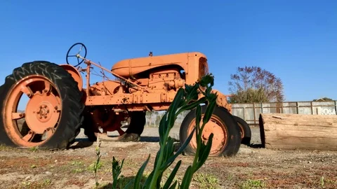 Old tractor on aged farm Stock Footage 125838826