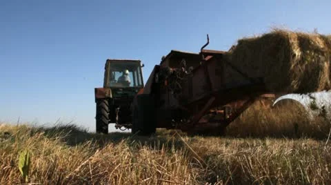 Old Tractor baler machine in the field of Ukraine Stock Footage 18222801