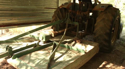 Old tractor engaging the slasher Stock Footage 29169720