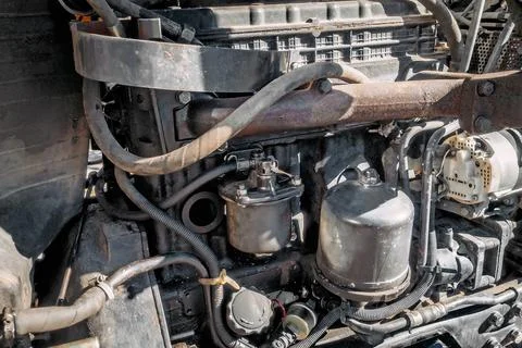 Old tractor engine close-up. Worn out engine in full frame. Background Stock-Fotos