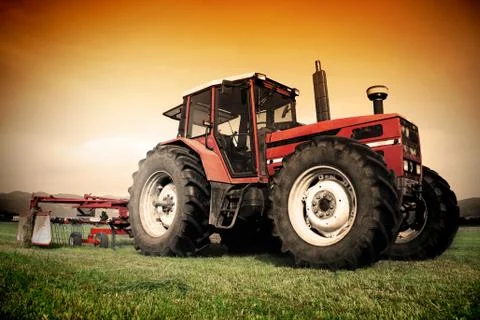 Old tractor on the field Stock Photos