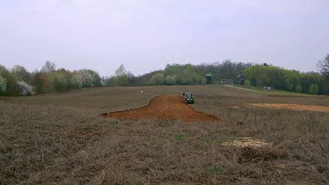 Old tractor plowing field Stock Footage 97466213