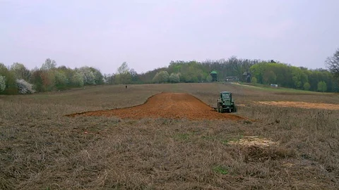 Old tractor plowing field Video stock 98554649