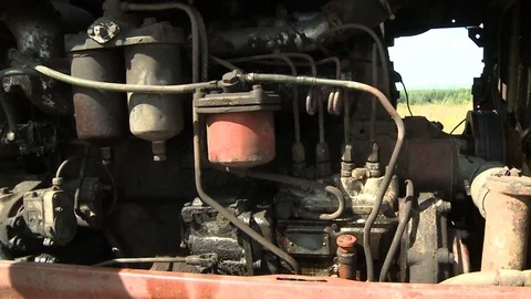 Old tractor plowing the soil. Farmer0 Stock Footage 85383645
