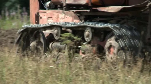 Old tractor plowing the soil. Farmer4 Stock Footage 85381686
