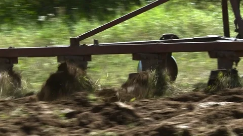 Old tractor plowing the soil. Farmer9 Stock Footage 85382710