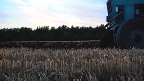 Old tractor plows Stock Footage 154427269