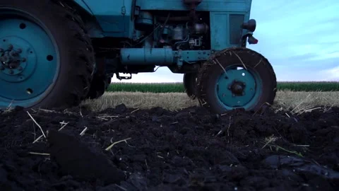 Old tractor plows Stock Footage 154427280