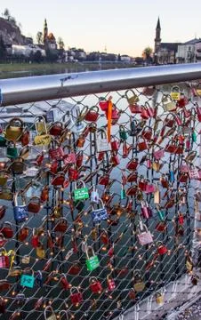 Old tradition of sealing a couple's names inscribed padlock with bridge Stock Photos