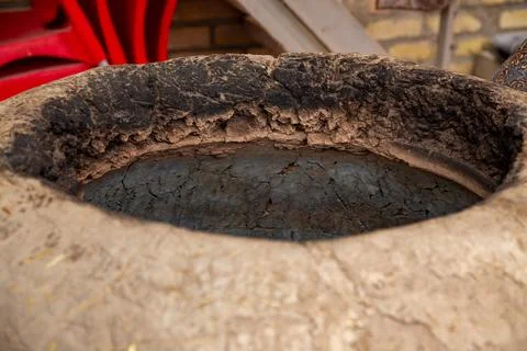 An old traditional bread making oven with a circular hole in the top made of  스톡 사진