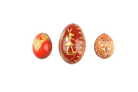Old traditional handmade easter eggs from years 1944 on white background. Stock Photos