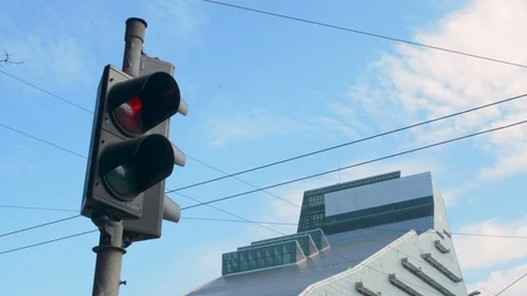 Old traffic light in front of a new modern library building skyscraper and blue 動画素材 110806553