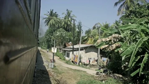 Old train arriving to the small sri lanka mountain village Video stock 73287015