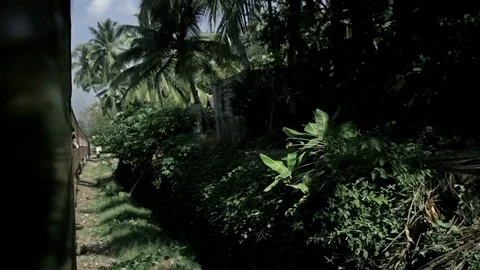 Old train arriving to the small sri lanka mountain village Stock Footage 73287252