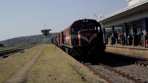 Old Train Arriving at Train Station in Mozambique Africa Stock Footage 90230704