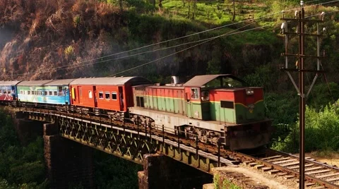 Old train on metal bridge in highlands countryside. Sri Lanka. 4K Stock Footage 60435517