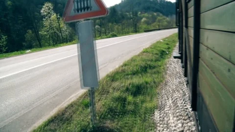 Old Train Moves on Rails next to the Road Vídeo Stock 93552479