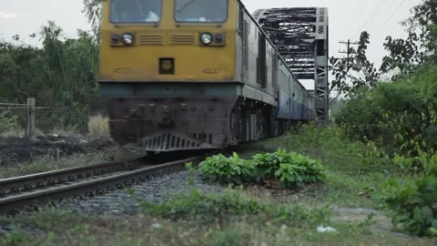 An old train is passing over an old iron bridge. Stock Footage 250075242