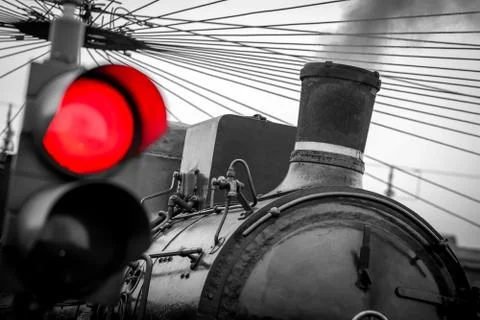 Old train with red traffic light - black and white image Stock Photos