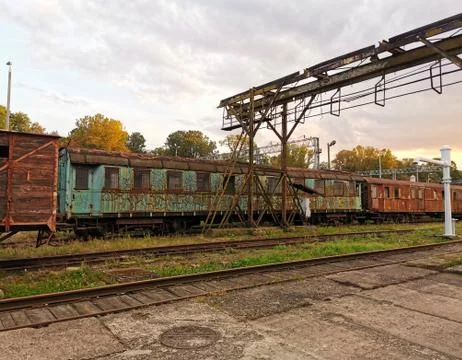 The old train is at the train station. Stock Photos