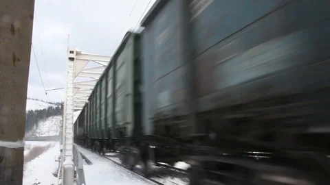 An old train travels by rail to the countryside in winter. Stock Footage