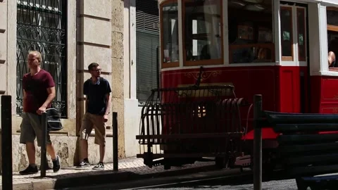 Old tram going through the streets of Lisbon Stock Footage