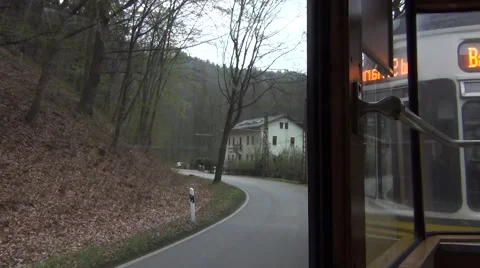 Old tram going uphill arrives to the Schneiderweiche siding stop Stock Footage 64908706