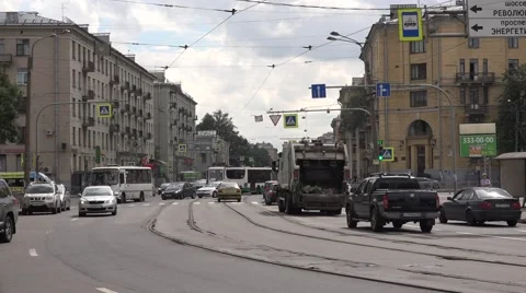 Old tram passes a curve in mixed traffic at Sredneoktinsky prospekt Stock Footage 67468271