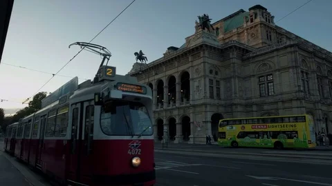 Old tram pulls away at Vienna Opera House Stock Footage 82008751