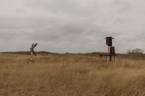 An old transformer without wires is in the field Stock Photos