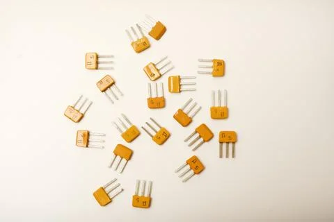 Old transistors on a white background. Electronic elements. Stock Photos