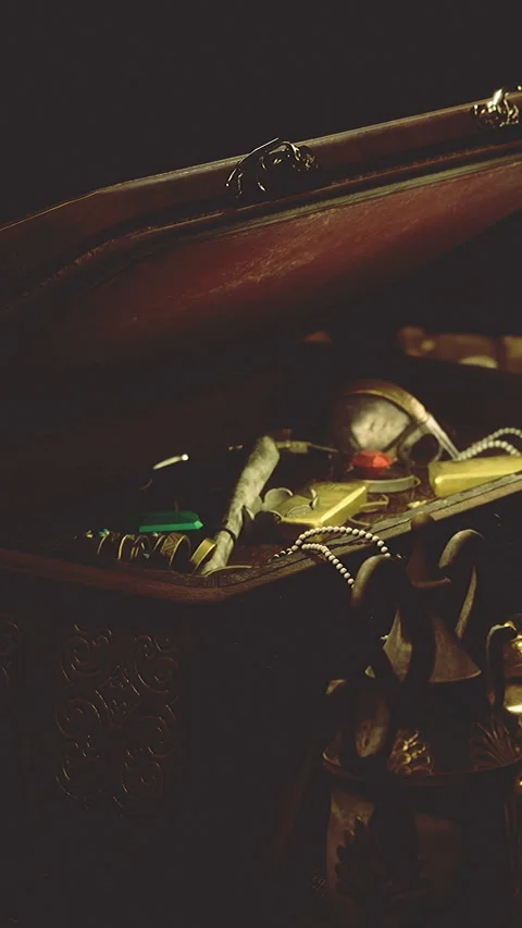 Old treasure box with tools and items in a dim setting at night Stock Footage 336166767