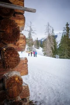 The old tree trunks of an old hut in a ski resort Stock Photos