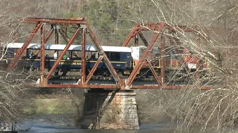 OLD TRESTLE WITH TRAIN CROSSING RIVER Stock Footage 11173552