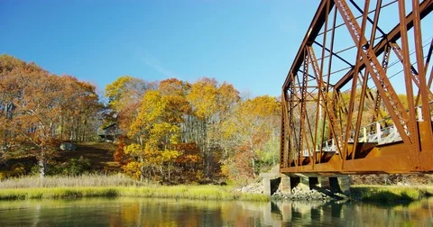 Old Trolly Bridge surrounded by marsh and swamp in a small coastal New England Stock Footage 73334534