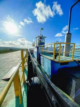 Old tugboat pulling ferry boat platform Stock Photos