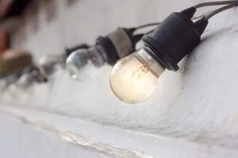 Old Tungsten hang the wall. Stock Photos