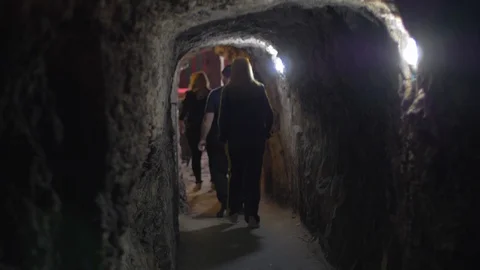 Old tunnels carved manually lead to a cellar Vídeo Stock 106016005