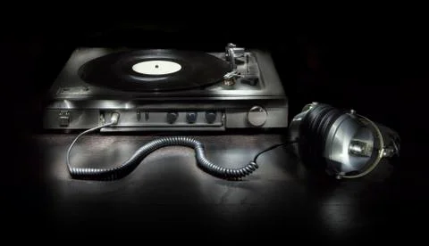 Old turntable with headphones Stock Photos