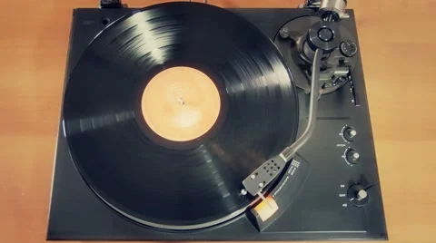 Old turntable player vinyl record playing top view Stock Footage
